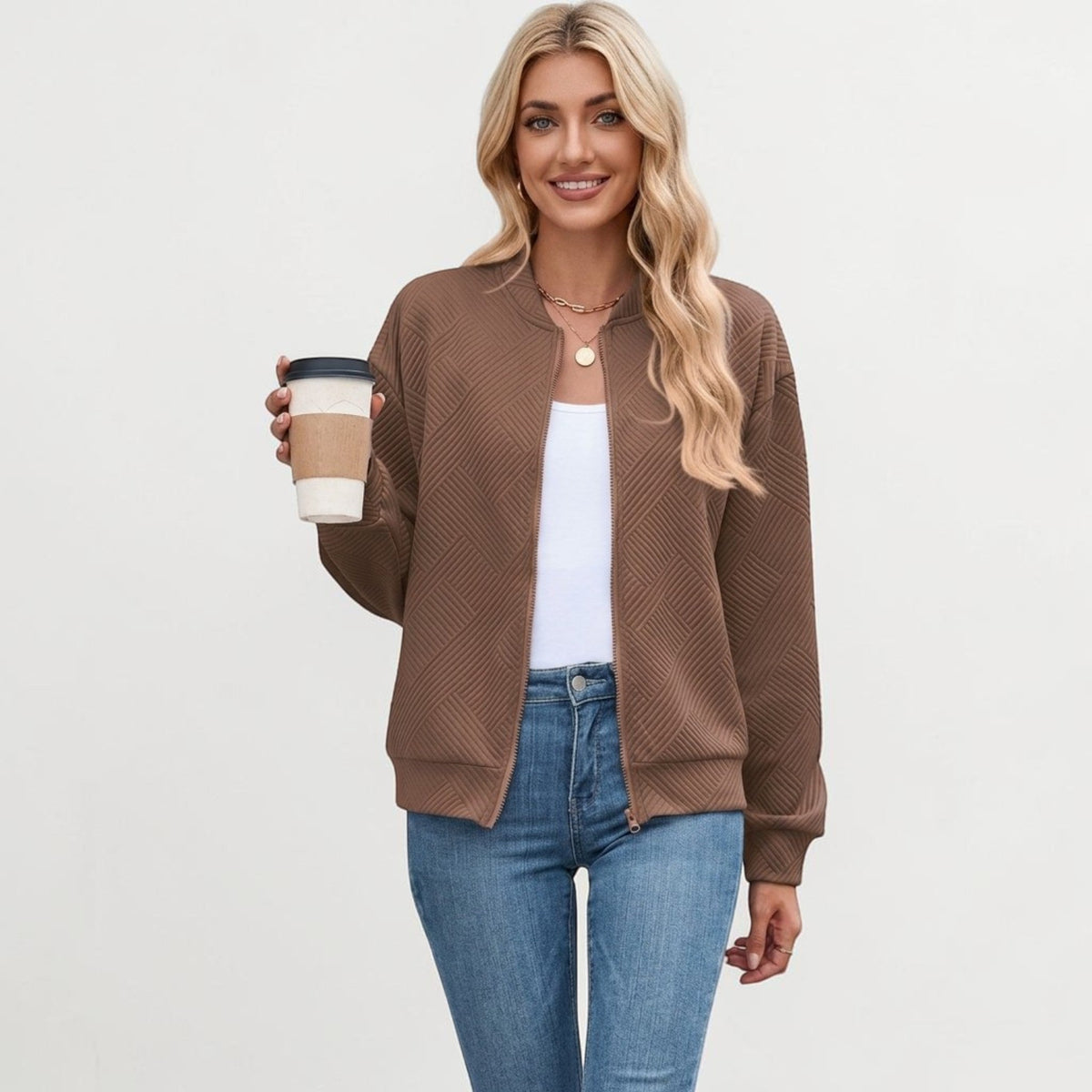 Brown cropped textured knit bomber jacket with ribbed cuffs and stand collar, relaxed fit.