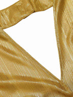 Gold textured fabric of a halter V-neck jumpsuit with subtle shimmer finish