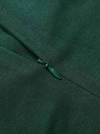 Green placket with small zipper pull detail at neckline