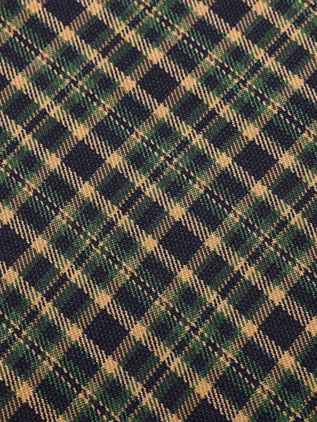 Plaid fabric with navy, tan, and green grid checks