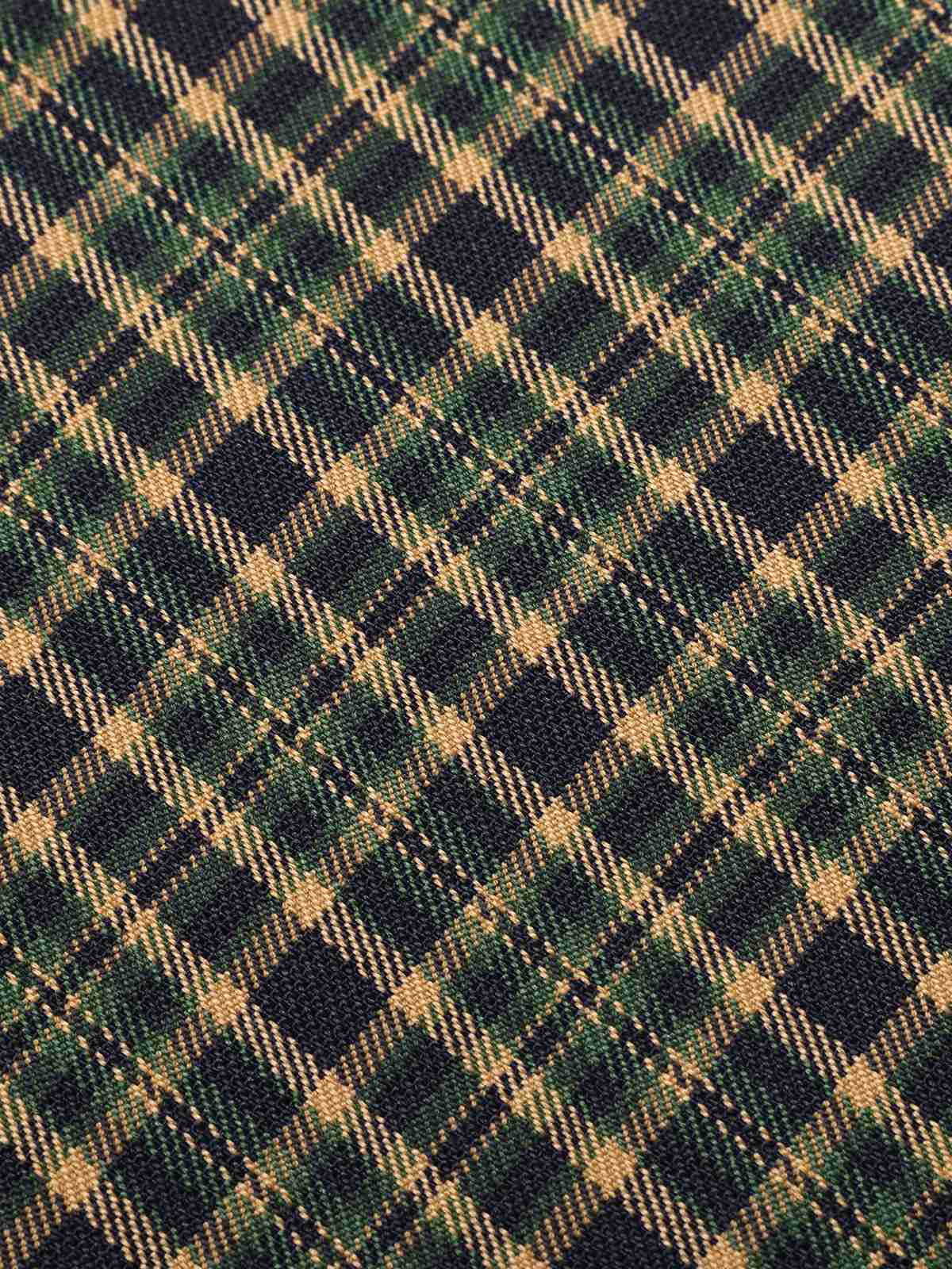 Plaid fabric with navy, tan, and green grid checks