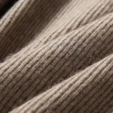Close-up of striped rib knit texture on a women’s hoodie in brown