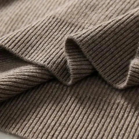 Ribbed knit cuff close-up on a women’s hoodie in taupe and brown