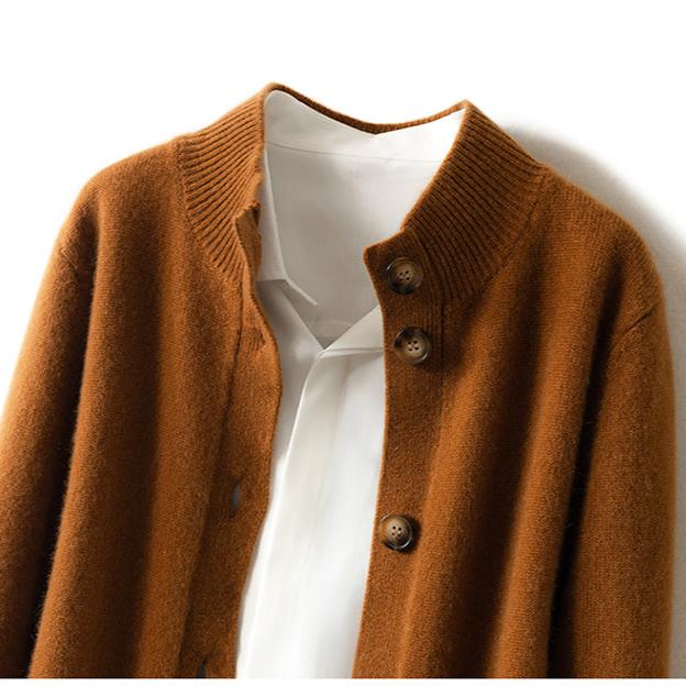 Fire orange button cardigan close-up with round wooden-style buttons.