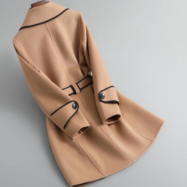 Womens tan overcoat with cuff buttons and panel seams on the back