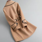 Womens tan overcoat with cuff buttons and panel seams on the back