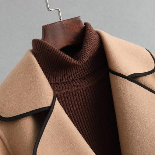 Camel overcoat with wide knit collar and black trim detail at neckline