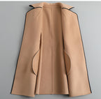 Womens tan back view overcoat with seams, flap pockets, and buttoned cuffs