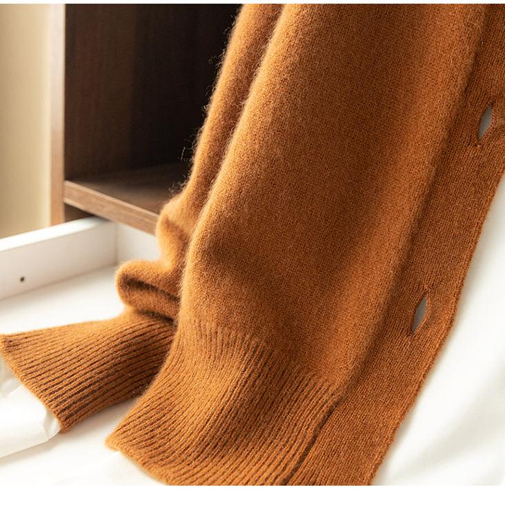 Fire orange knit cardigan sleeve cuff with ribbed edge.