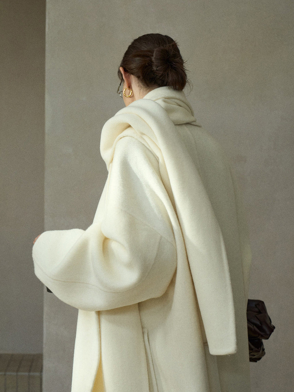 Cream wool wrap coat with matching scarf, back view with draped hood