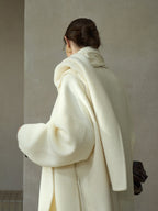 Cream wool wrap coat with matching scarf, back view with draped hood