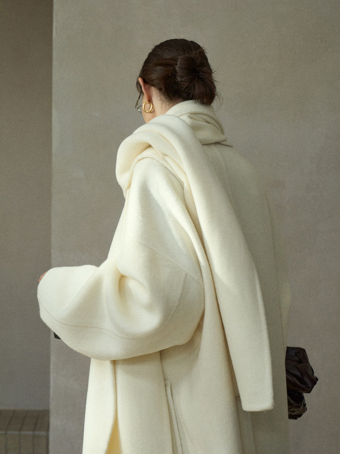 Cream wool wrap coat with matching scarf, back view with draped hood