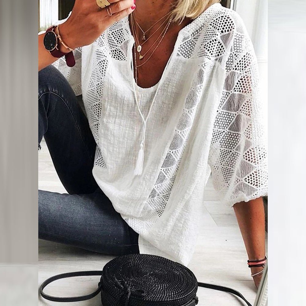 White breezy blouse with V-neck and lace eyelet sleeves, loose fit
