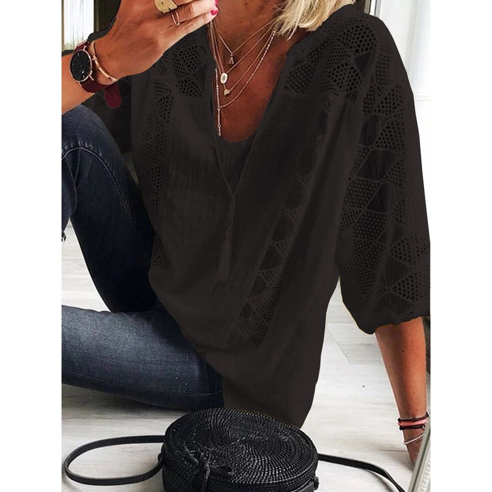 Black breezy blouse with V-neck and lace eyelet sleeves, loose fit