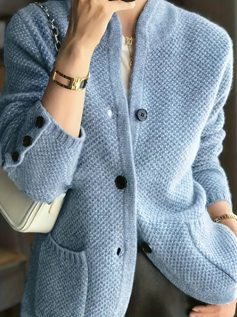Powder blue knit cardigan with button front and dark buttons, long sleeves, relaxed fit