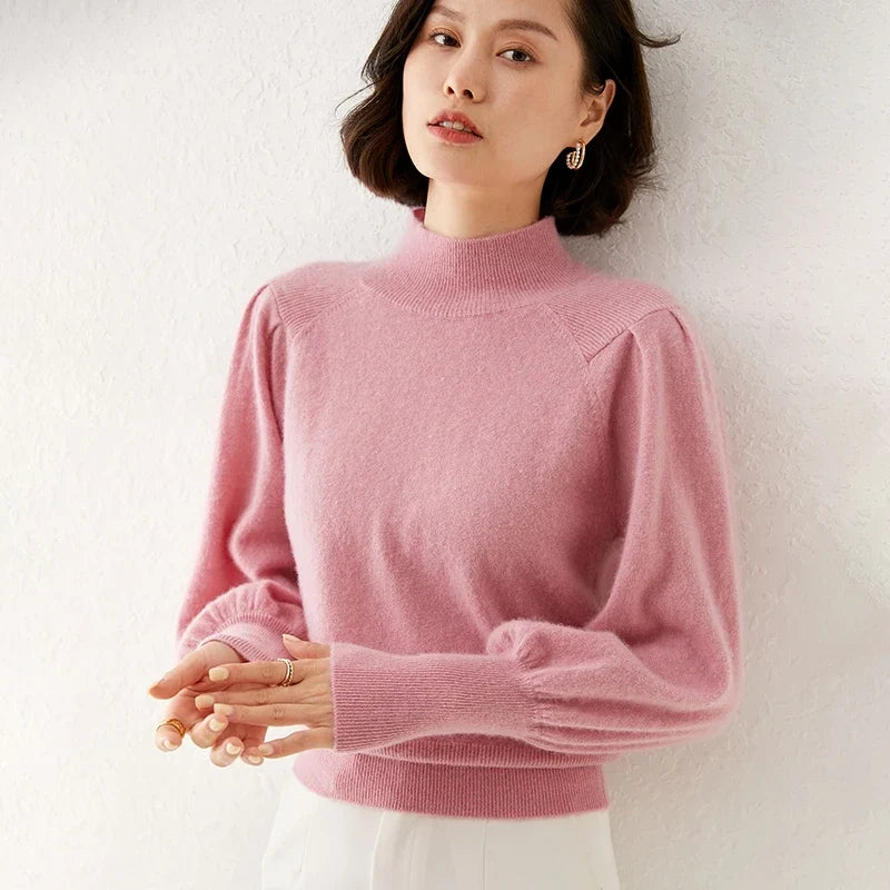 Light pink merino turtleneck sweater with puff sleeves and textured knit
