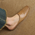 Tan/brown leather mules with braided woven pattern, slip-on fit, pointed toe