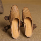 Tan/brown genuine leather mules pair with woven upper and pointed toe, side/front