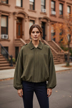 Olive green relaxed utility jacket with shirt collar and button-front placket