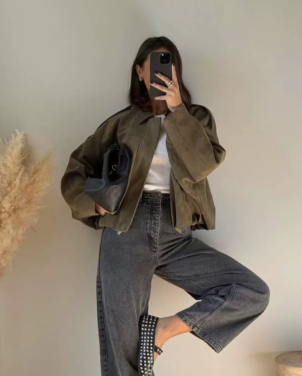 Olive green relaxed utility jacket with shirt collar and long sleeves