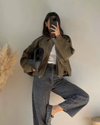 Olive green relaxed utility jacket with shirt collar and long sleeves