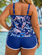 Plus size printed tankini set back view in navy with colorful tropical floral peplum top