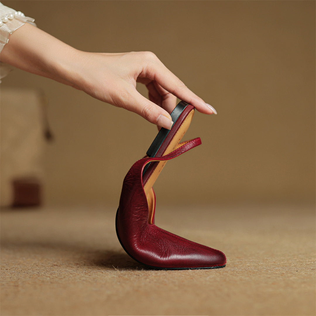 Wine red genuine leather pointed-toe flats with ankle-strap detail and open heel area