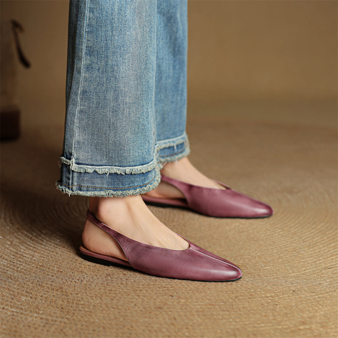 Mauve genuine leather pointed-toe flats, worn with cuffed blue jeans