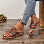 Women’s colorful patterned adjustable flat sandals with tassel accents and ankle chain strap