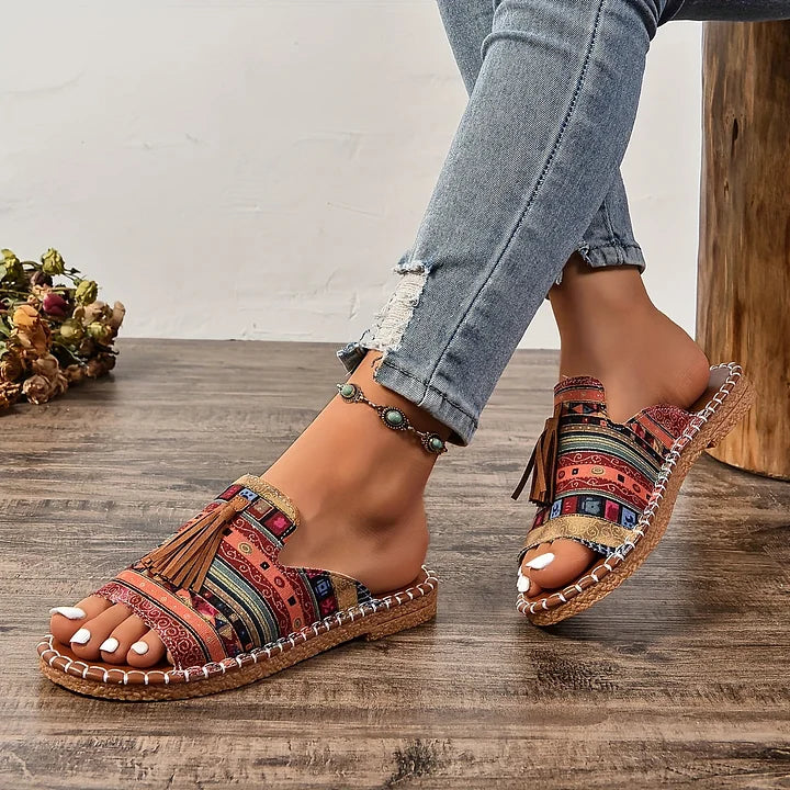 Women’s colorful patterned adjustable flat sandals with tassel accents and ankle chain strap