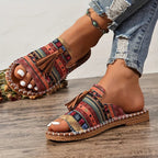 Women’s multicolor patterned slide sandals with tassel front and adjustable ankle strap