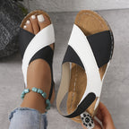 Black and white orthopedic sandal with open toe and stitched footbed strap detail