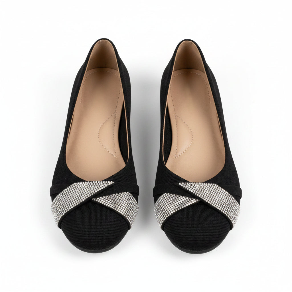 Black orthopedic flats with silver glitter strap across the toe, low wedge sole