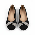 Black orthopedic flats with silver glitter strap across the toe, low wedge sole