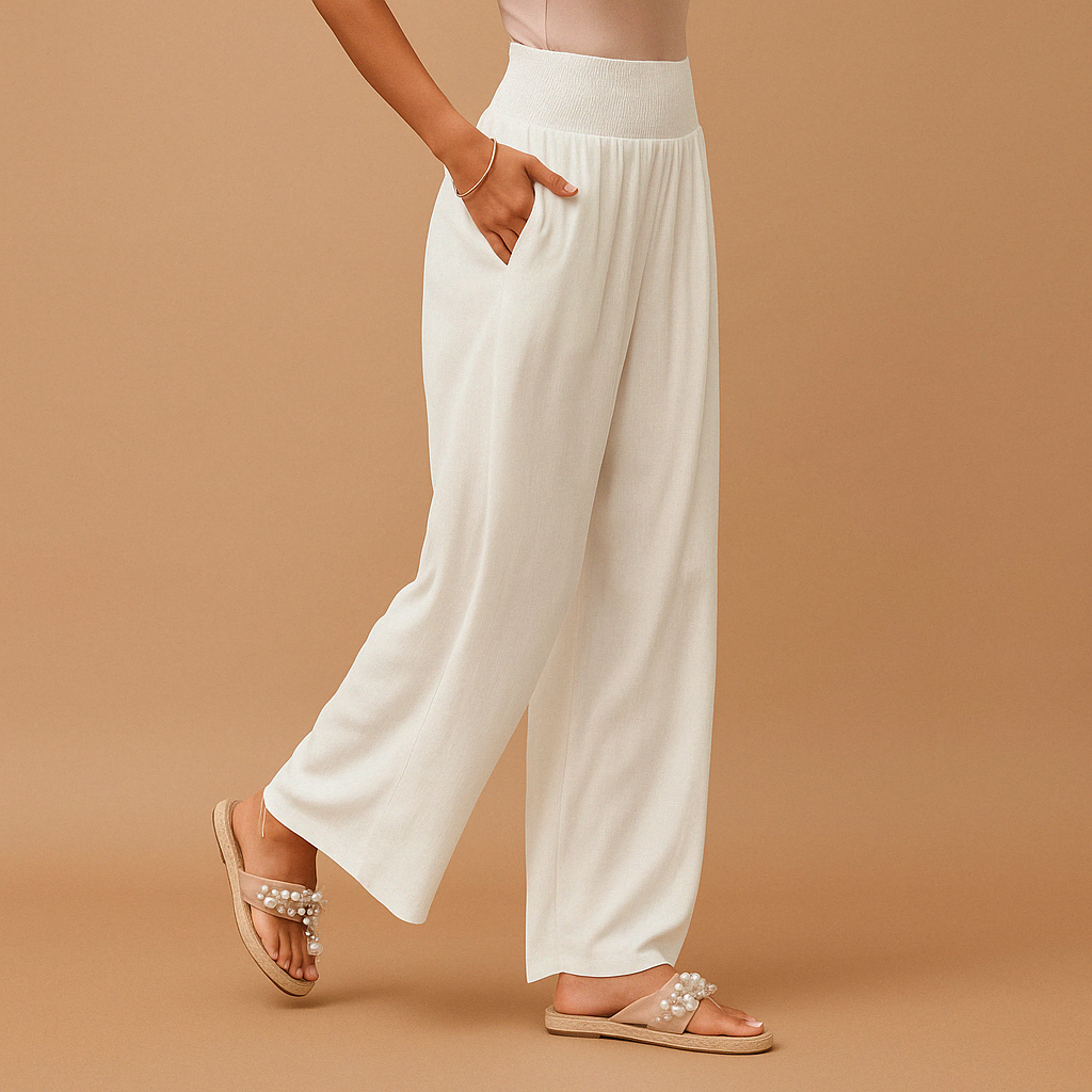 White high-waisted wide-leg trousers with elastic waistband and relaxed drape