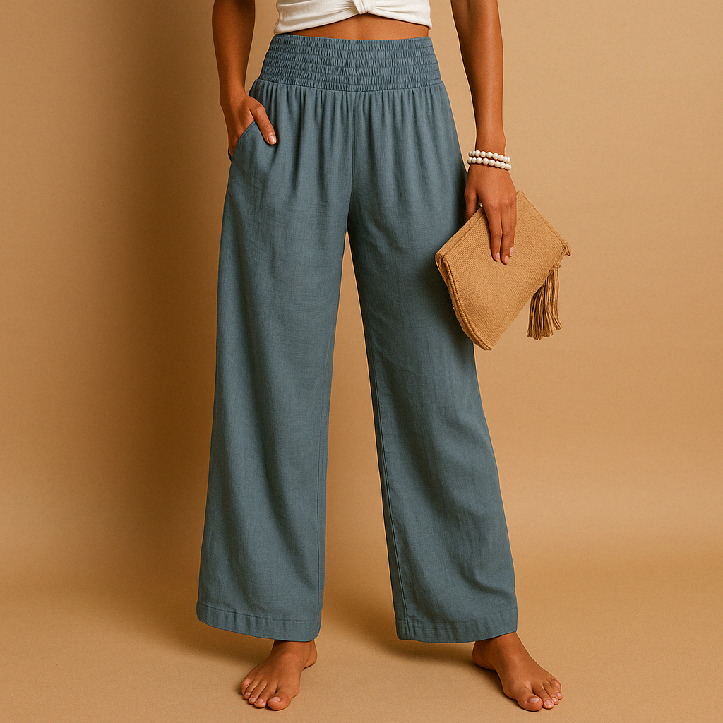 Teal-blue high-waisted wide-leg trousers with elastic waist and flowing wide legs