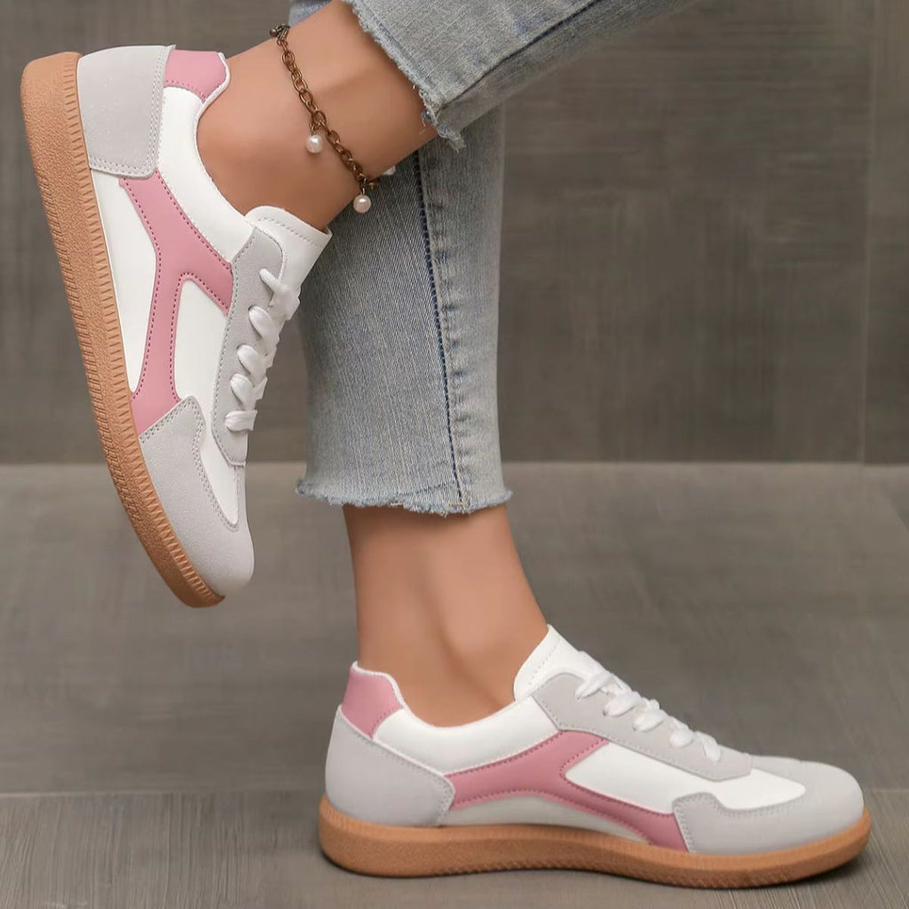 Pink and white lace-up sneakers with side panel detail and gum sole
