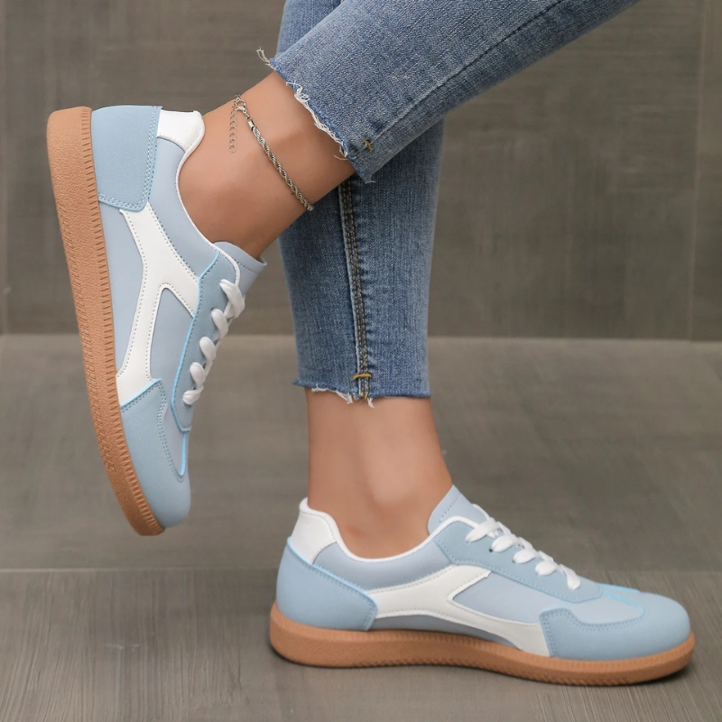 Blue and white lace-up sneakers with contrasting side stripe and gum sole
