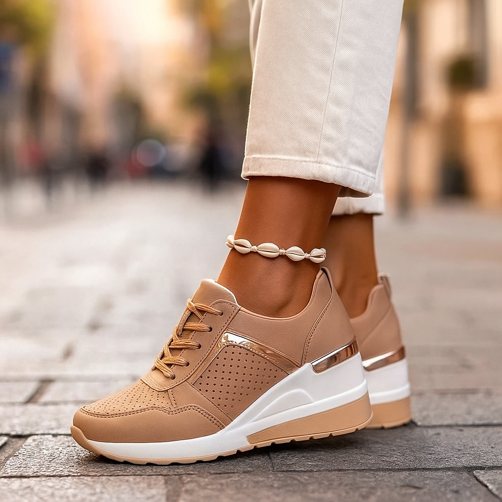 Tan lift sneakers with perforated panels, gold-tone trim, and lace-up