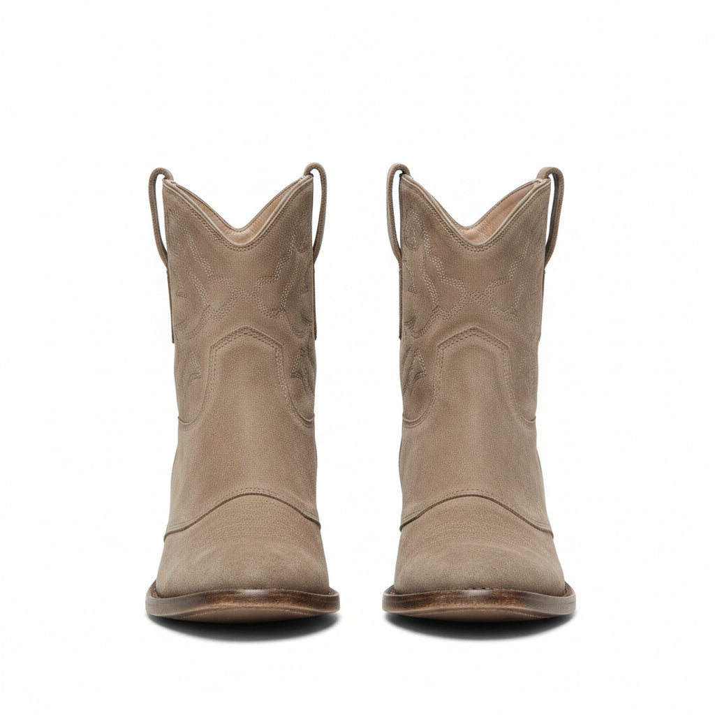Brown suede cowboy ankle boots with pointed toe, stacked block heel, side pull tabs.
