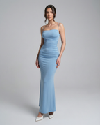 Light blue ruched spaghetti-strap maxi dress with fitted waist and flared mermaid hem