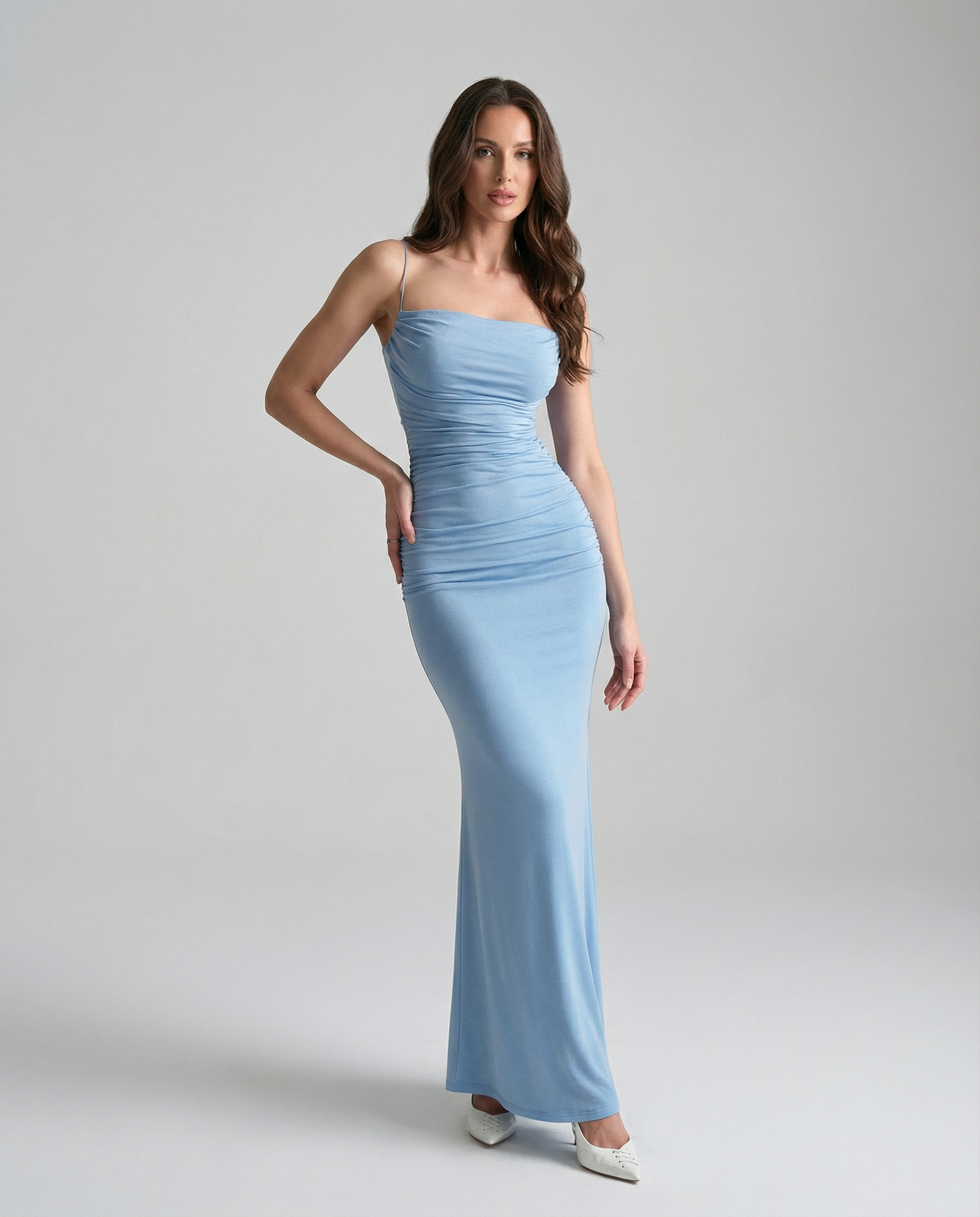 Light blue ruched spaghetti-strap maxi dress, fitted silhouette and long mermaid skirt
