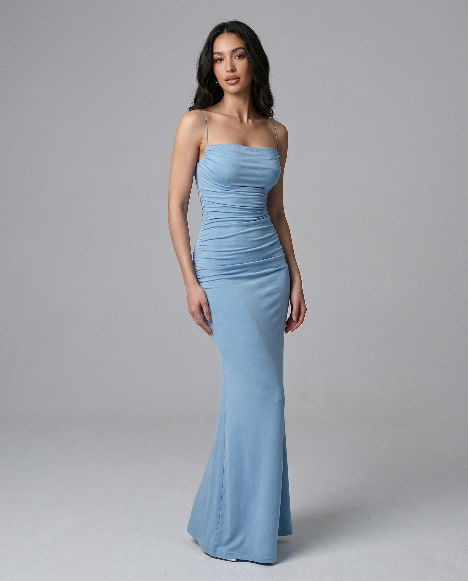 Light blue ruched spaghetti-strap maxi dress with fitted bodice and mermaid hem