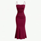 Dark red ruched spaghetti-strap maxi dress with fitted bodice and flared mermaid hem