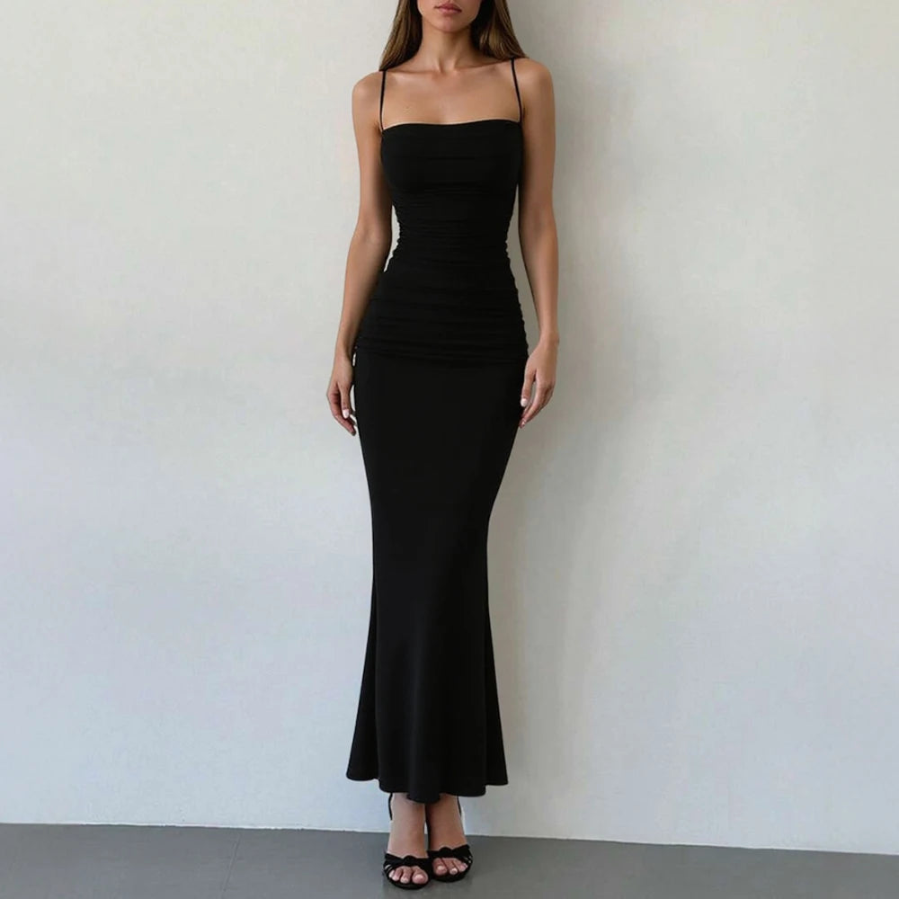 Black ruched spaghetti-strap maxi dress with fitted bodice and flared mermaid hem