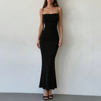 Black ruched spaghetti-strap maxi dress with fitted bodice and flared mermaid hem