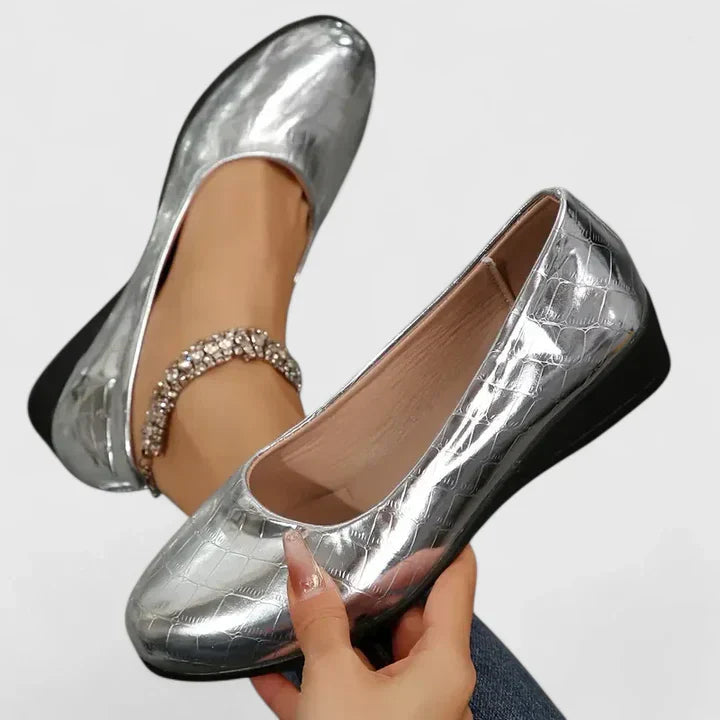 Orthopedic flats, metallic silver croc-embossed finish with rhinestone ankle chain