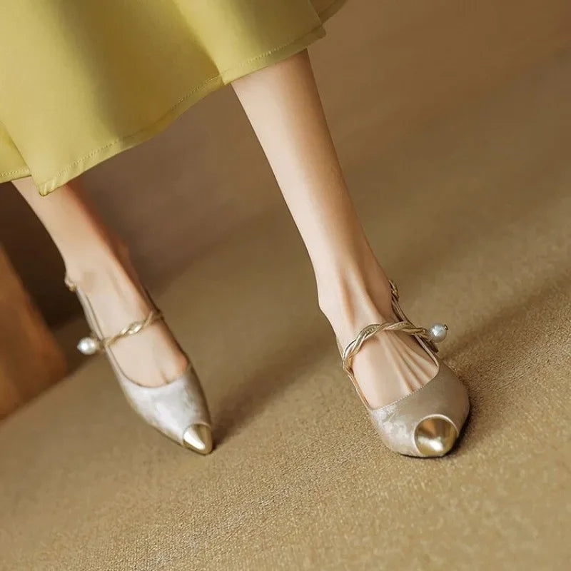 Beige elegant pumps with open-toe front and pearl ankle strap