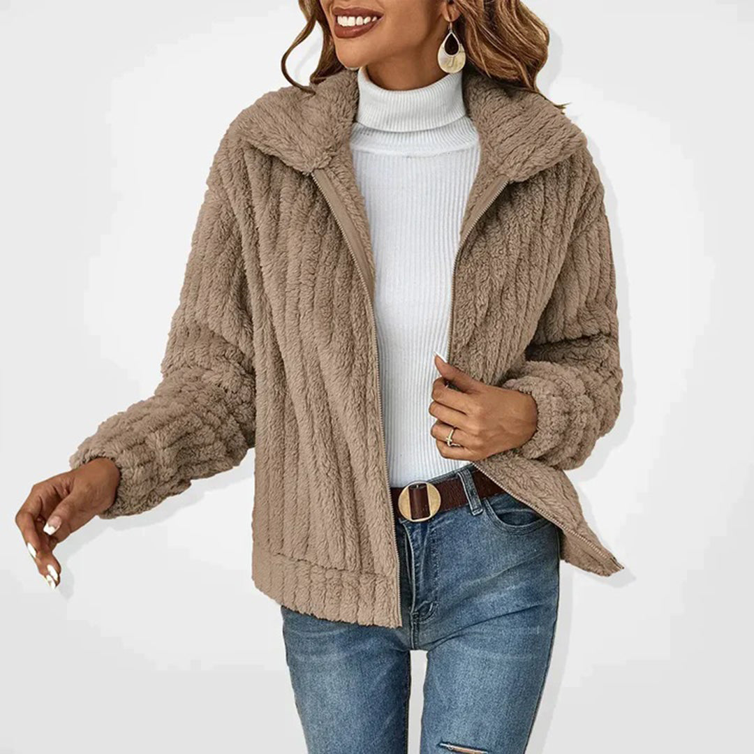 Light beige women’s long zip-up fleece vest with high collar and textured shaggy fabric
