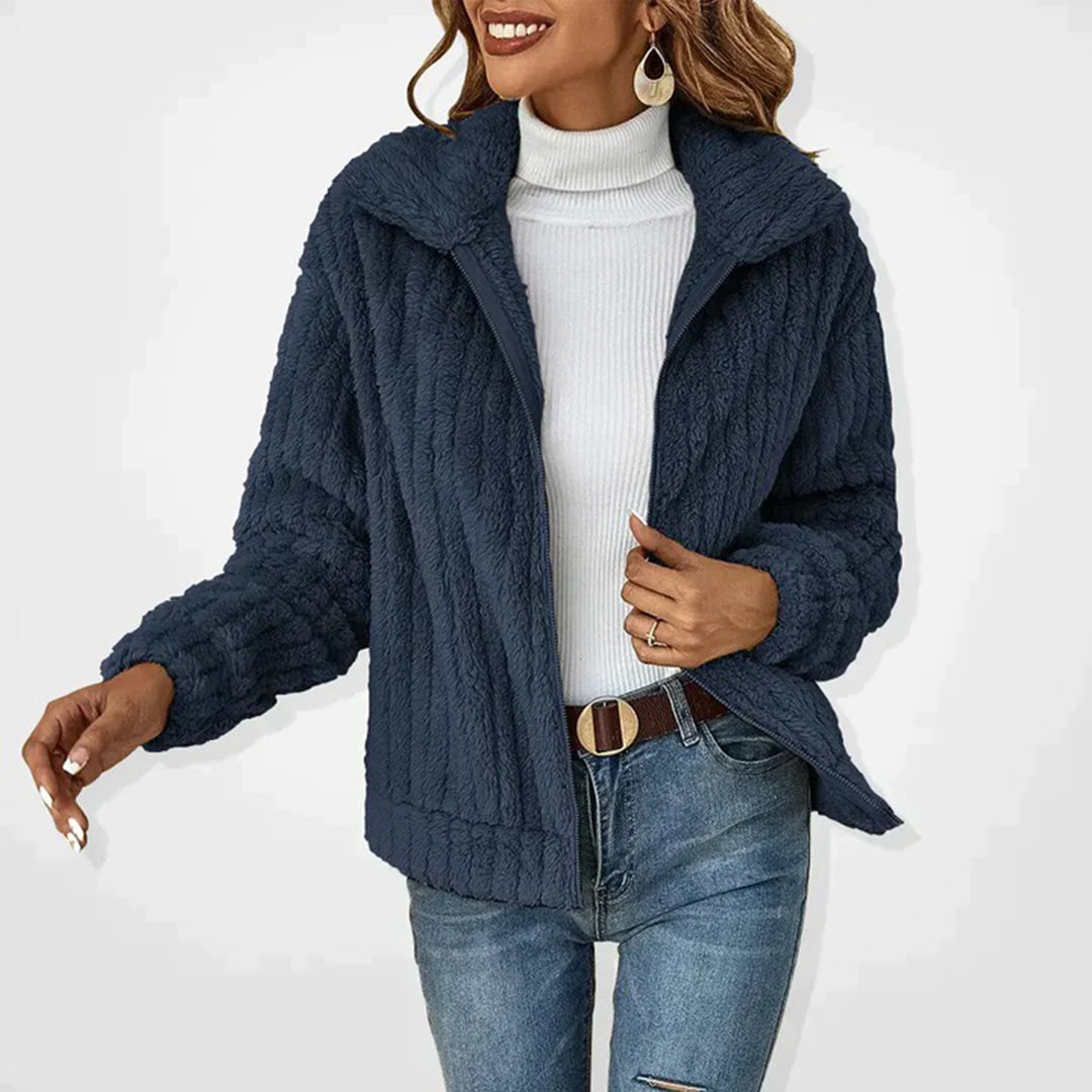 Navy women’s long fleece vest with zip front and high collar, textured plush fleece